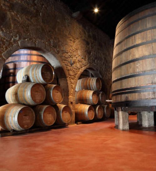 Old fashioned Porto wine cellar with wooden barrels in Porto, Portugal
